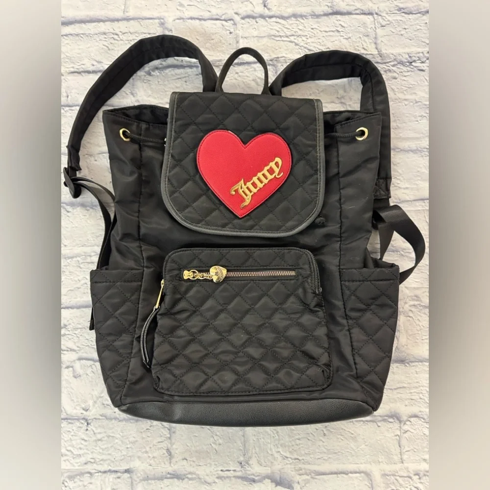Juicy Couture black quilted backpack heart motif, drawstring top.